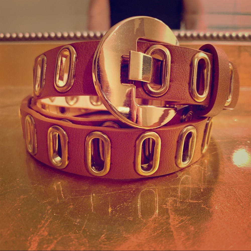 Tan leather and gold buckle belt